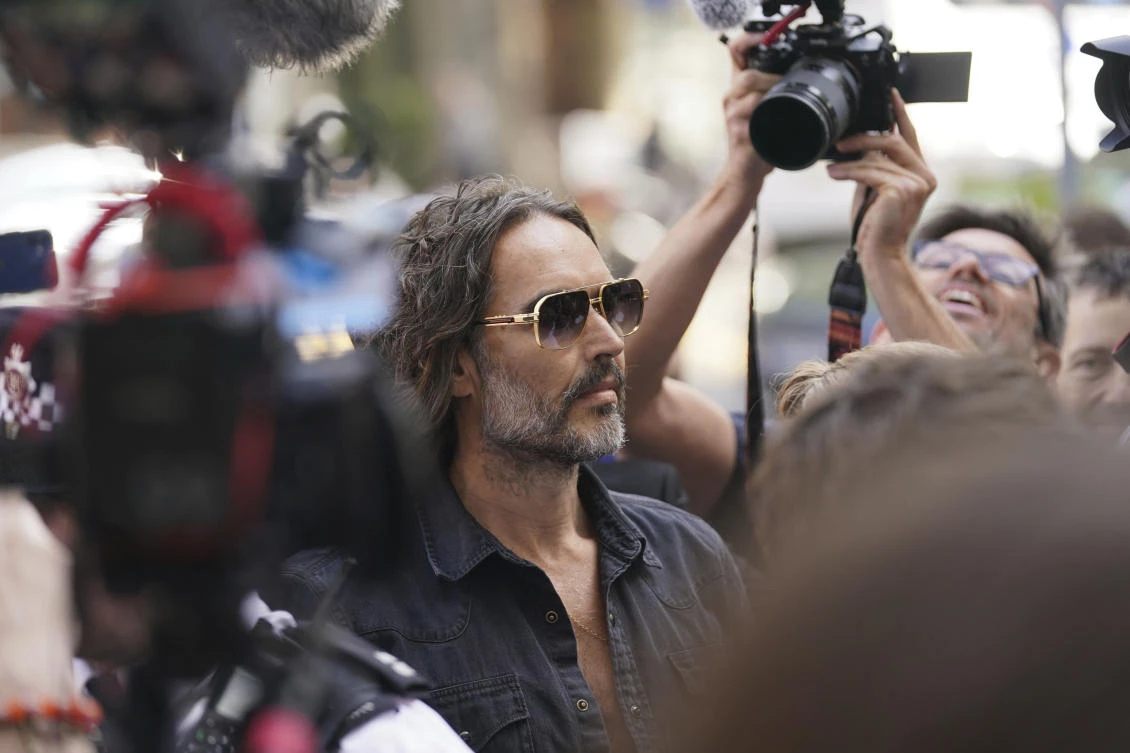 UK comedian Russell Brand appears in court on rape charges