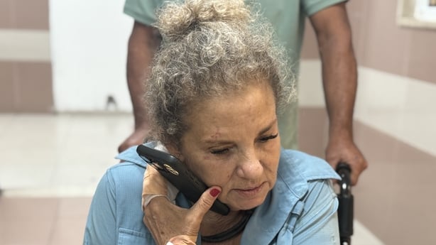 Heidi Levine, American photojournalist for The Washington Post on the phone in hospital